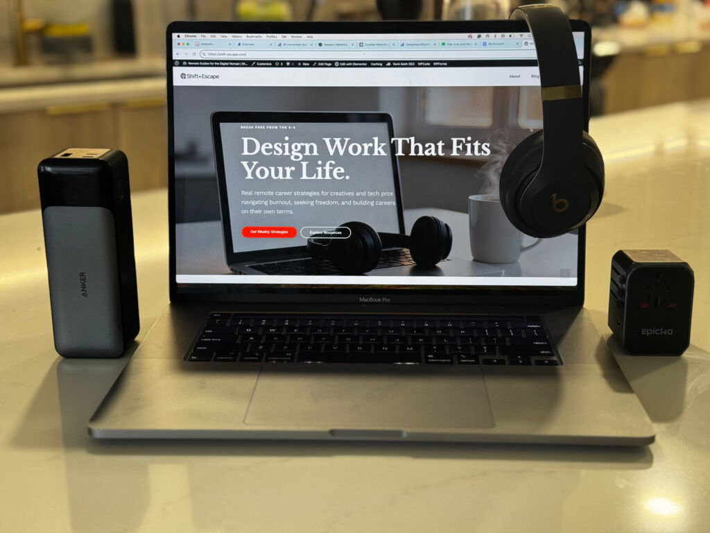 Digital nomad tech stack workspace setup MacBook Pro Anker power bank Beats headphones remote work gear